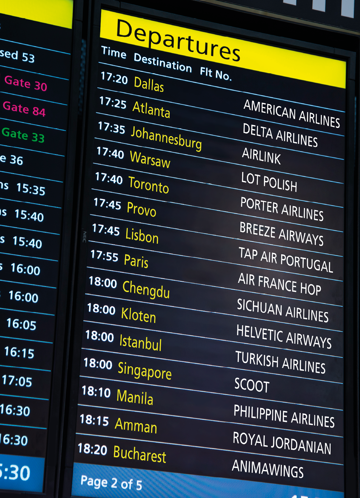 Screens showing flight details at an airport.